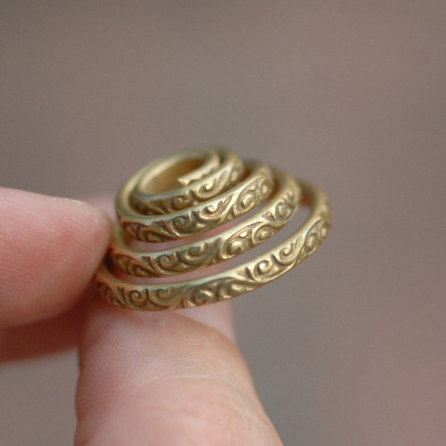 Flourish pattern brass ring